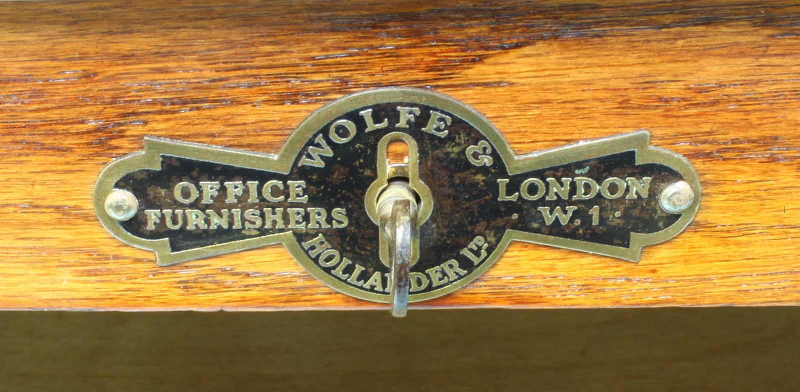 A 1920's oak music cabinet with locking tambour front, opening to reveal multiple wooden trays. - Image 4 of 4