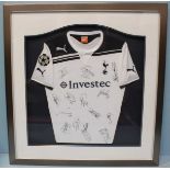 A framed Tottenham Hotspur football club Champions League kit c.2010-2011, signed by the team.