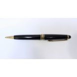 A Montblanc Meisterstuck ballpoint pen. With black body, gold plated detailing and clip, trademark
