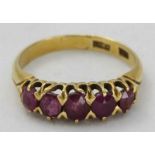 An 18ct gold five stone Ruby ring, ring size L, total weight 3.0g