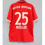 A Bayern Munich home shirt signed by Thomas Muller from the 2016/17 season, with his name and number