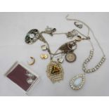 A small collection of costume jewellery, including two silver necklaces, one with a hanging coin