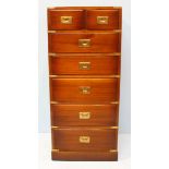 A narrow brass bound mahogany campaign chest of two short over five long graduated drawers, and