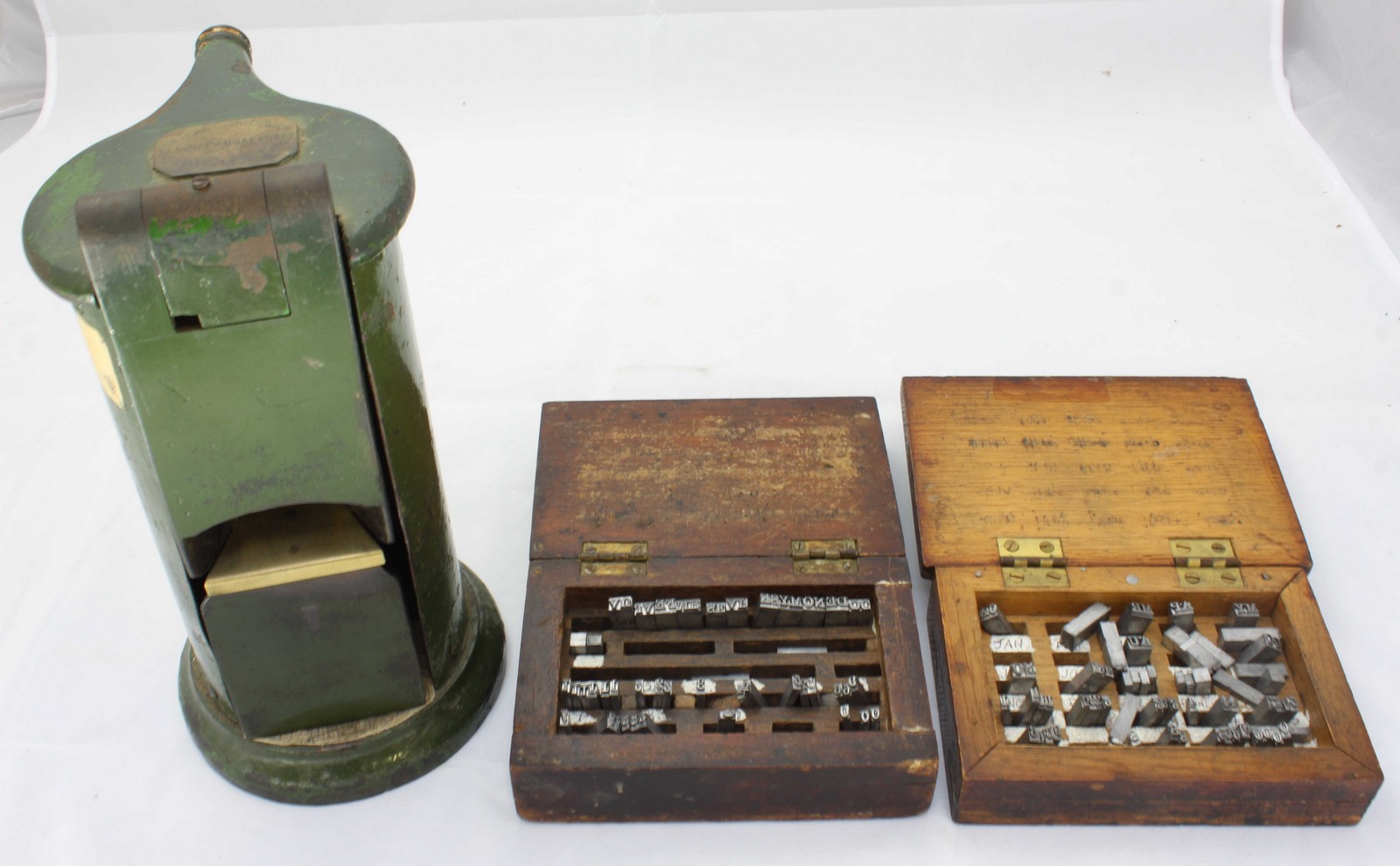 A Railway ticket punching machine by Waterlow & Sons, London, 25cm high, together with two boxes