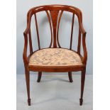 An Edwardian inlaid mahogany parlour tub chair, with blue floral fabric upholstered seat and