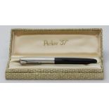 A Parker '51' fountain pen, silver cap and with black body, in original case with instructions.