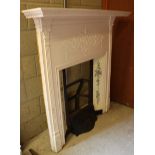 A large wrought iron fire surround, painted in white with 10 decorative ceramic tiles depicting