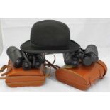 Two pairs of 10x50mm binoculars in leather cases, together with an Aristos of London bowler hat