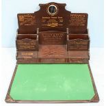 An early 20th Century advertising folding stationary box, the back with small circular mirror and