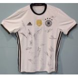 A signed Germany 2014 World Cup Champions shirt, signed by the whole Germany team, Size M, with