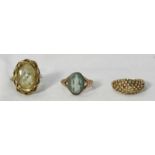 A group of three 9ct gold rings, including a cameo ring, one set with a large yellow stone and