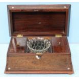 A 19th century rosewood sarcophagus tea caddy, the hinged top opening to reveal a fitted interior