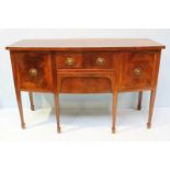 An Edwardian mahogany bow-front sideboard in the Sheraton style. With ebony stringing throughout,