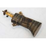 A late 19th / early 20th century Persian metal-mounted cow horn powder flask, with carved