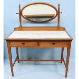 A 20th Century ash-wood dressing table with oval mirror, glass top revealing a floral fabric above