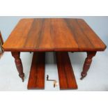 An Edwardian stained walnut extending dining table, together with a set of six Edwardian inlaid