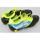 A pair of size 8 Puma 'PWR-C 3' football boots signed by Peter Crouch.