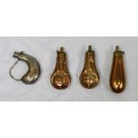 A pair of embossed brass pistol powder flasks with brass dispensers and scrollwork decoration,