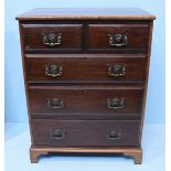 A stained mahogany chest of two short and three long graduated drawers with brass handles and