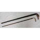 A silver handled, Macassar ebony walking stick, together with a modern cane, the handle carved and