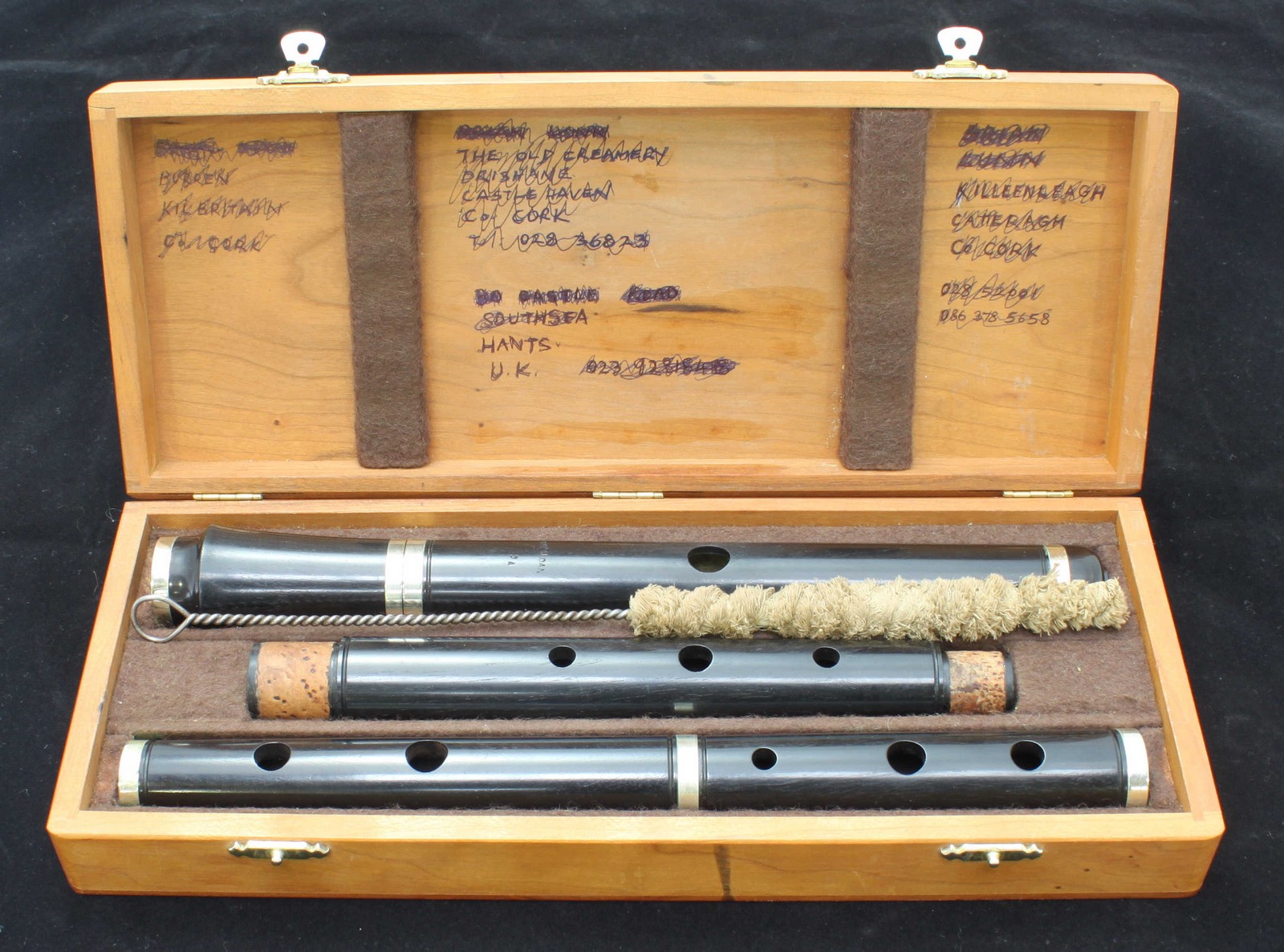 A 1960's handmade African Blackwood flute by Irish maker 'Ray Sloan' with nickel straps and in