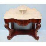 A Victorian mahogany washstand, the shaped marble top and back with shelf, above a single frieze