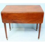 An Edwardian mahogany pembroke table, single frieze draw with opposing faux drawer, raised on inlaid