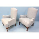 A pair of stained wood armchairs, each with light blue, floral fabric upholstery. 93cm high.