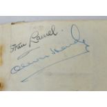 An autograph book containing signatures of Stan Laurel and Oliver Hardy, Dick Bogarde and Ann Todd
