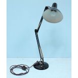 An angle-poise 'style' articulated desk lamp by 'Thousand & One Lamps Ltd,' black lacquered with