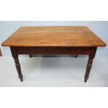 A pine kitchen table, with plain planked top, single frieze drawers to each end and raised on