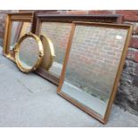 Four early 20th century mirrors, three square and one oval, two in gilt frames, largest measures
