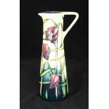 A Moorcroft ceramic 'Cricklade' pouring jug, designed by Rachel Bishop and signed Sian Leeper, in