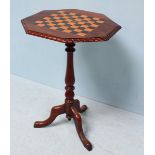 A 19th Century stained walnut tilt-top octagonal occasional table with chess board top. 72cm high.