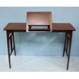 An Edwardian mahogany reading table, the centre with adjustable folding book stand, the sides with