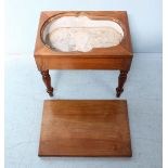 A Victorian walnut bidet, the top removing to reveal a metal pan, raised on turned supports. 48cm.