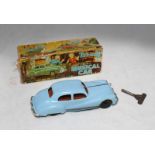 A Tri-ang Minic No.2 musical clockwork car, pale blue body with black underside and chrome grill and