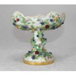 A 19th Century Dresden porcelain comport, the lattice pierced bowl ornately decorated with