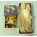 A late 19th/early 20th century poured wax head and shoulders doll, with painted wooden limbs wearing