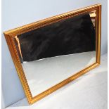 A 20th century gilt framed bevelled mirror. 113 x 87cm.