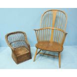 An Ercol elm Windsor chair together with a small child's wicker chair.