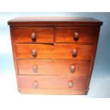 A Victorian stained mahogany chest of two short, over three long graduated drawers, raised on turned