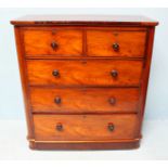 A Victorian mahogany chest of two short over three long graduated drawers, raised on bun feet. 103cm