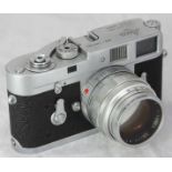 A Leica M2 rangefinder camera from 1963, reference no.1069984, with Leitz Summilux 1:1.4 50mm lens