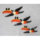 A set of three graduated Carlton Ware ceramic advertising wall plaques modelled as toucans balancing