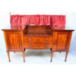 An Edwardian mahogany inlaid sideboard with two central drawers and two cupboards, three separate