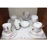 SECTION 23. A Thirty-piece Royal Albert 'Fancy Free' pattern ceramic tea set, comprising of cups,