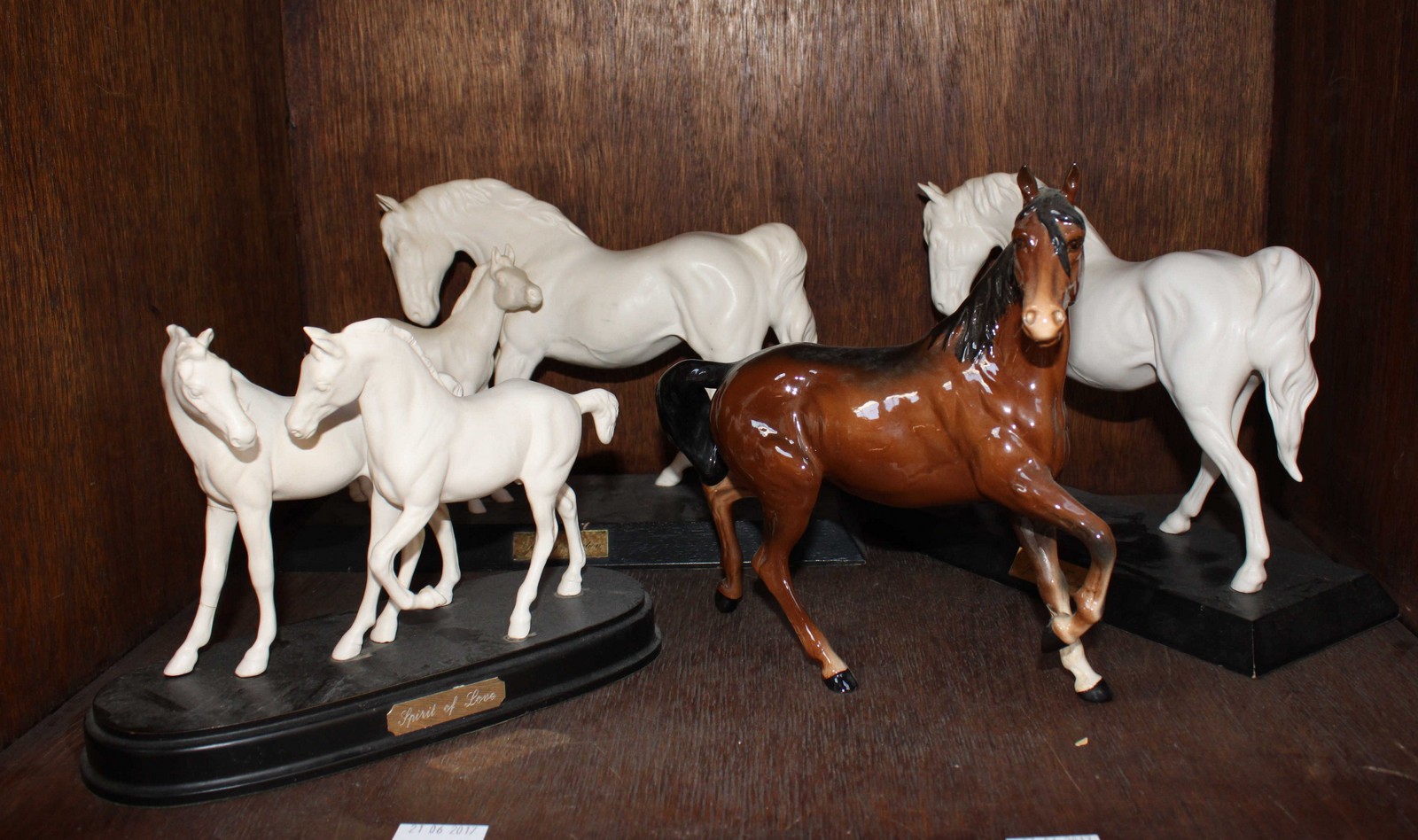 SECTION 33. Three Royal Doulton white horse figure-groups together with a Beswick ceramic horse, (