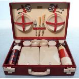 A 1950's Brexton picnic set for four people, including two Thermos flasks, two tin food boxes, tea