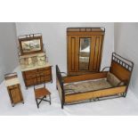 An early 20th century miniature oak and metal framed bedroom suite in the arts and crafts style,